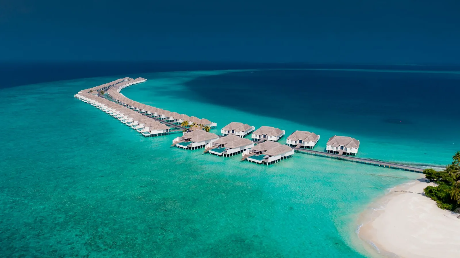 Overwater bungalows and turquoise lagoon in the Maldives