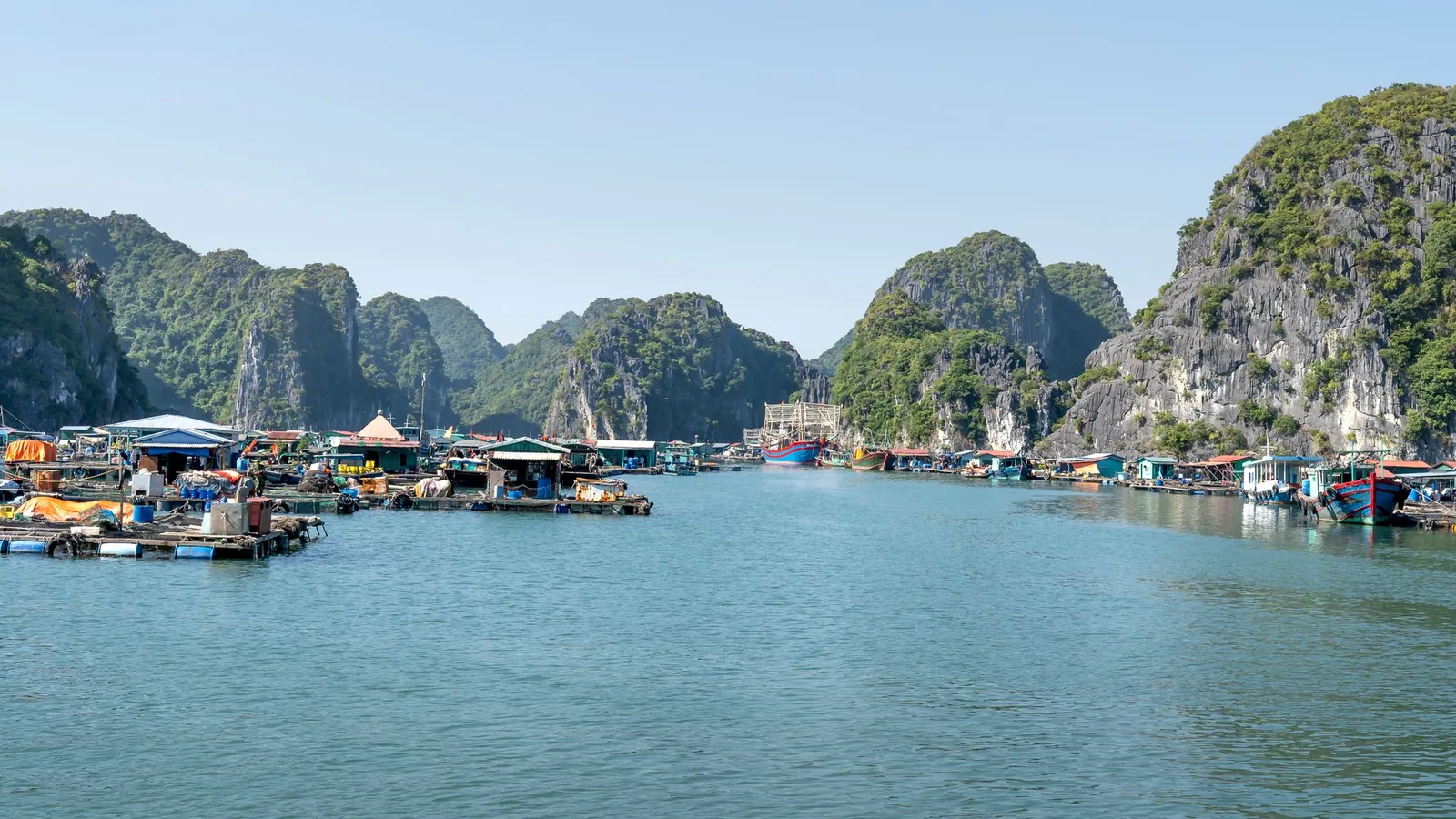 Karst islands rising through the waters of Ha Long Bay in Vietnam